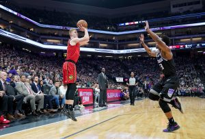 SACRAMENTO, CA - JANUARY 30: Kevin Huerter #3 of the Atlanta Hawks shoots over Yogi Ferrell #3 of the Sacramento Kings during an NBA basketball game at Golden 1 Center on January 30, 2019 in Sacramento, California. NOTE TO USER: User expressly acknowledges and agrees that, by downloading and or using this photograph, User is consenting to the terms and conditions of the Getty Images License Agreement. (Photo by Thearon W. Henderson/Getty Images)
