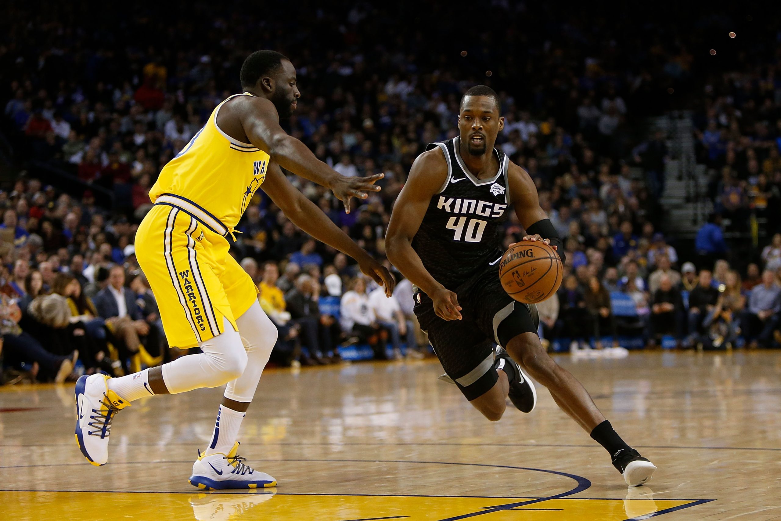Harrison Barnes #40 of the Sacramento Kings drives to the basket against Draymond Green #23 of the ...