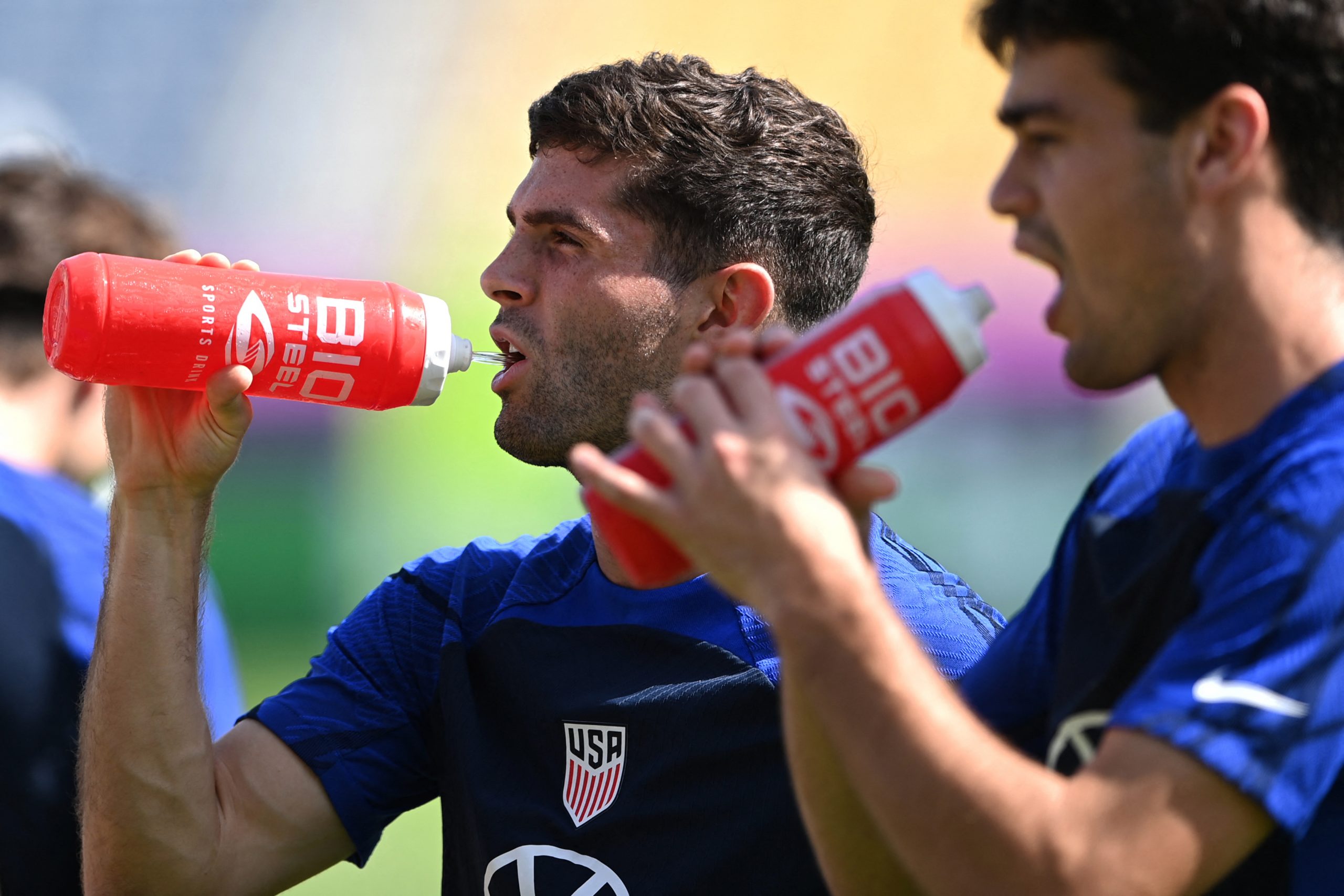 USA's midfielder Christian Pulisic (L) takes part in a training session at the team's training camp...