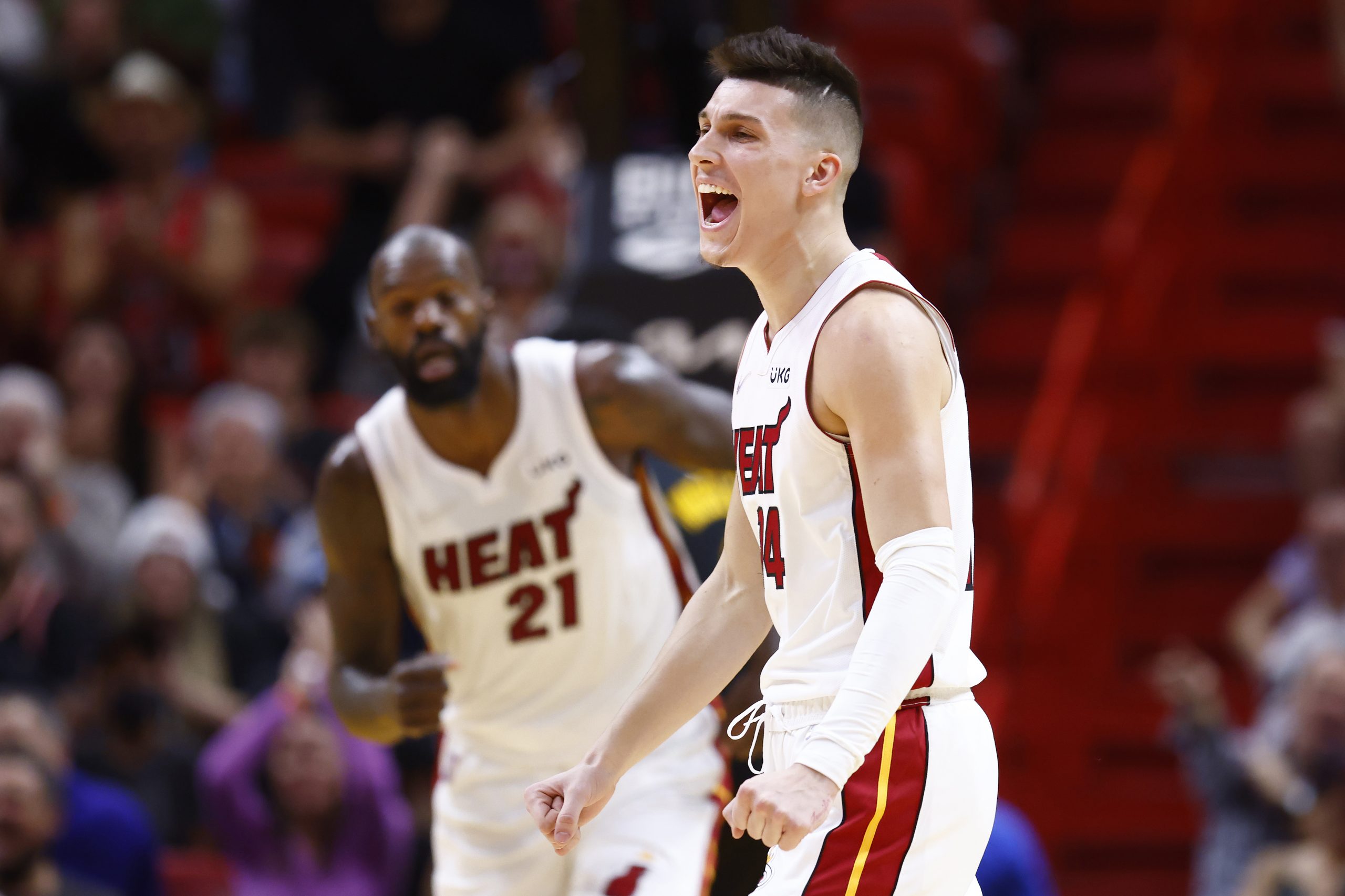 MIAMI, FLORIDA - DECEMBER 01: Tyler Herro #14 of the Miami Heat celebrates a three pointer by Max S...