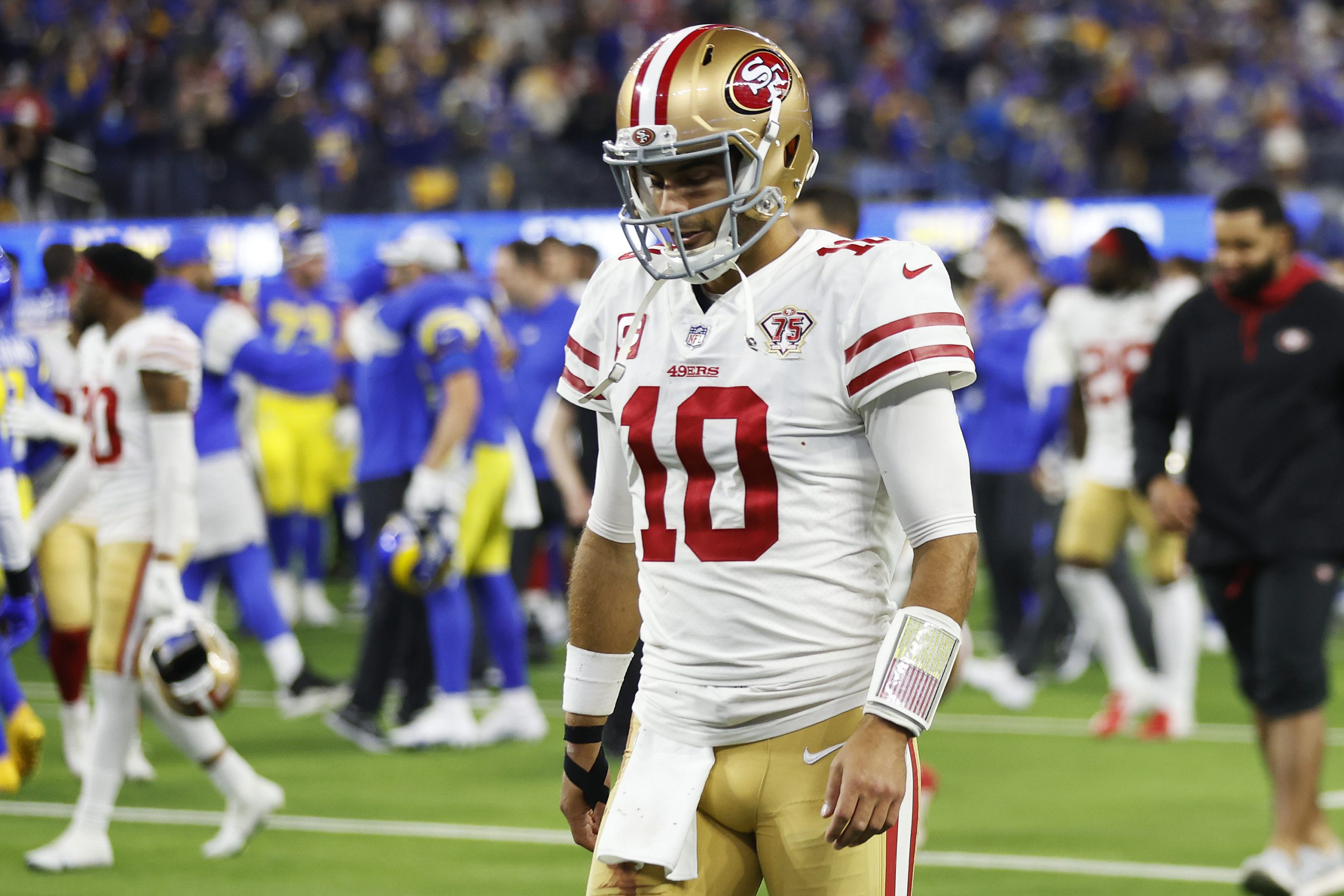 Jimmy Garoppolo #10 of the San Francisco 49ers walks off the field after being defeated by the Los ...