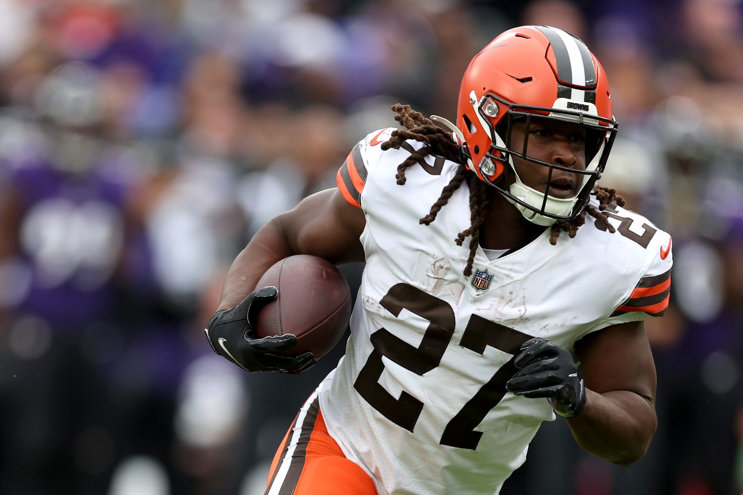 BALTIMORE, MARYLAND - OCTOBER 23: Running back Kareem Hunt #27 of the Cleveland Browns runs with th...