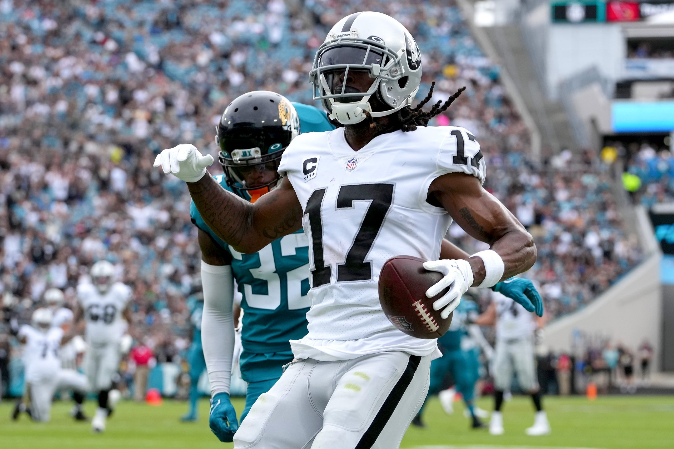 Davante Adams #17 of the Las Vegas Raiders catches a pass for a touchdown in the first quarter of t...
