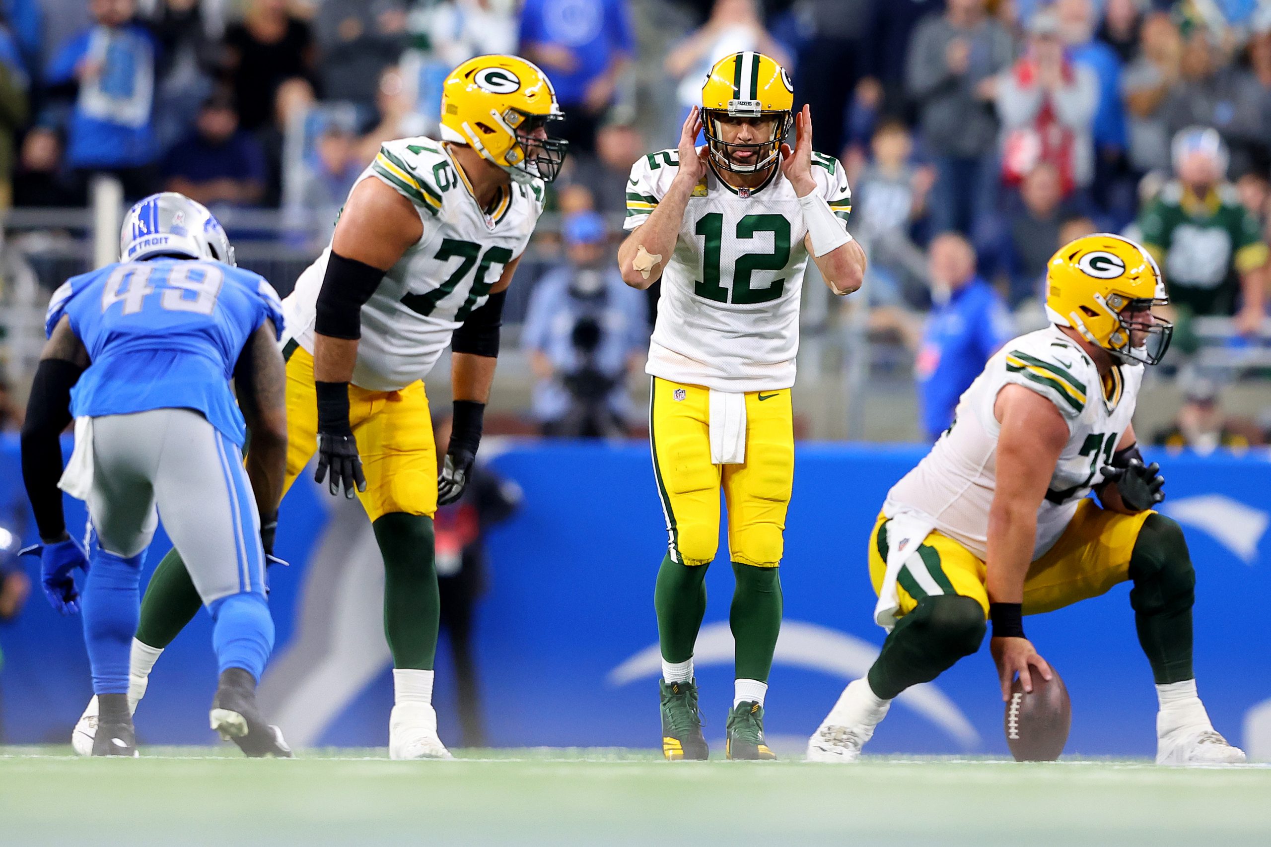Aaron Rodgers #12 of the Green Bay Packers signals in the fourth quarter of a game against the Detr...