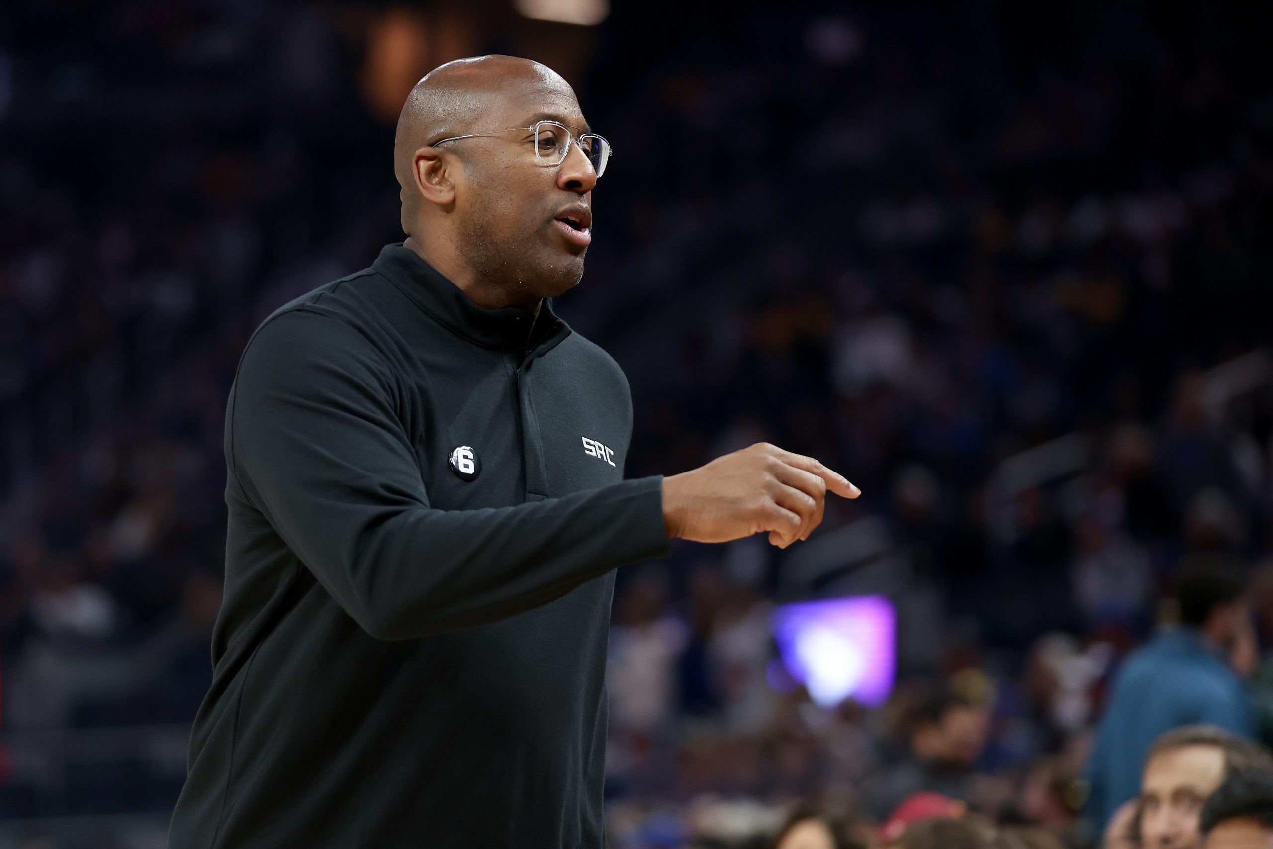 Sacramento Kings head coach Mike Brown talks to his team during their game against the Golden State...