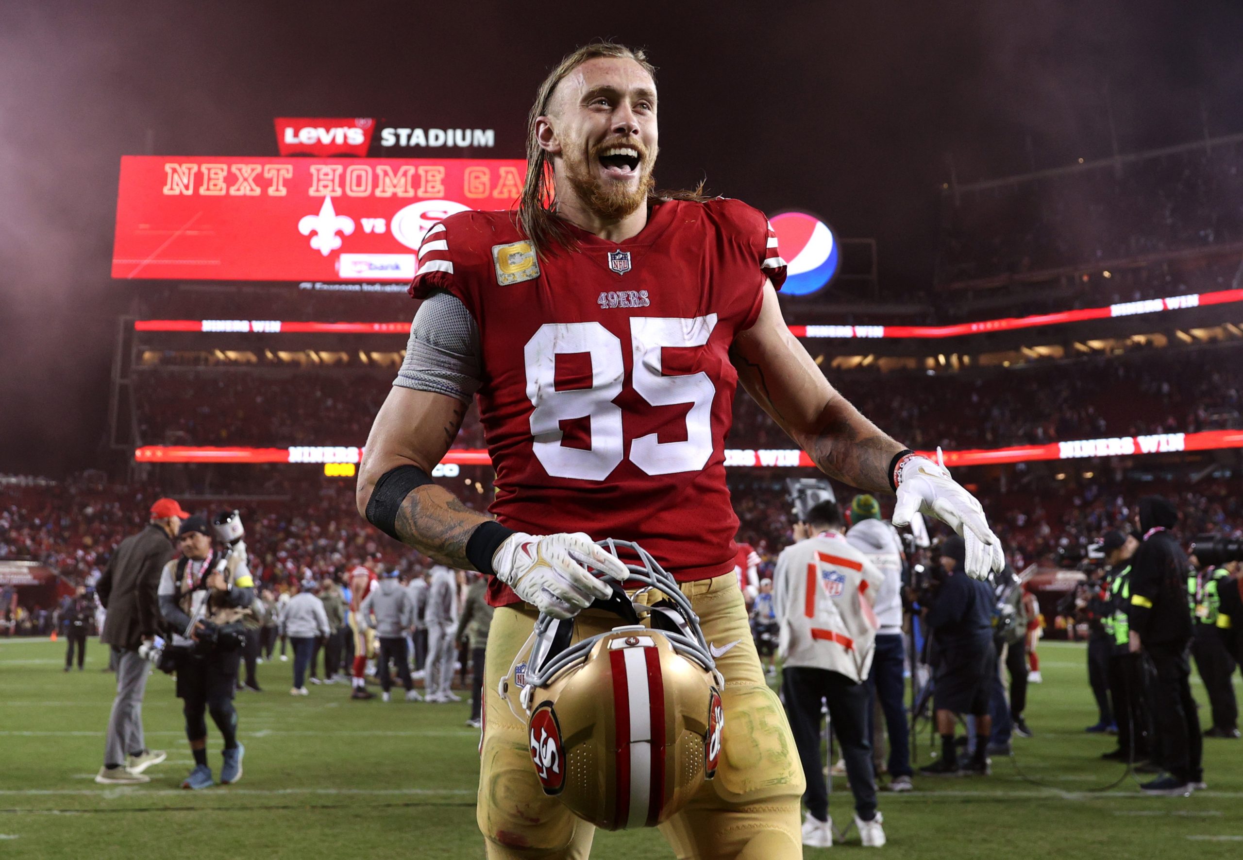 George Kittle #85 of the San Francisco 49ers reacts after defeating the Los Angeles Chargers at Lev...