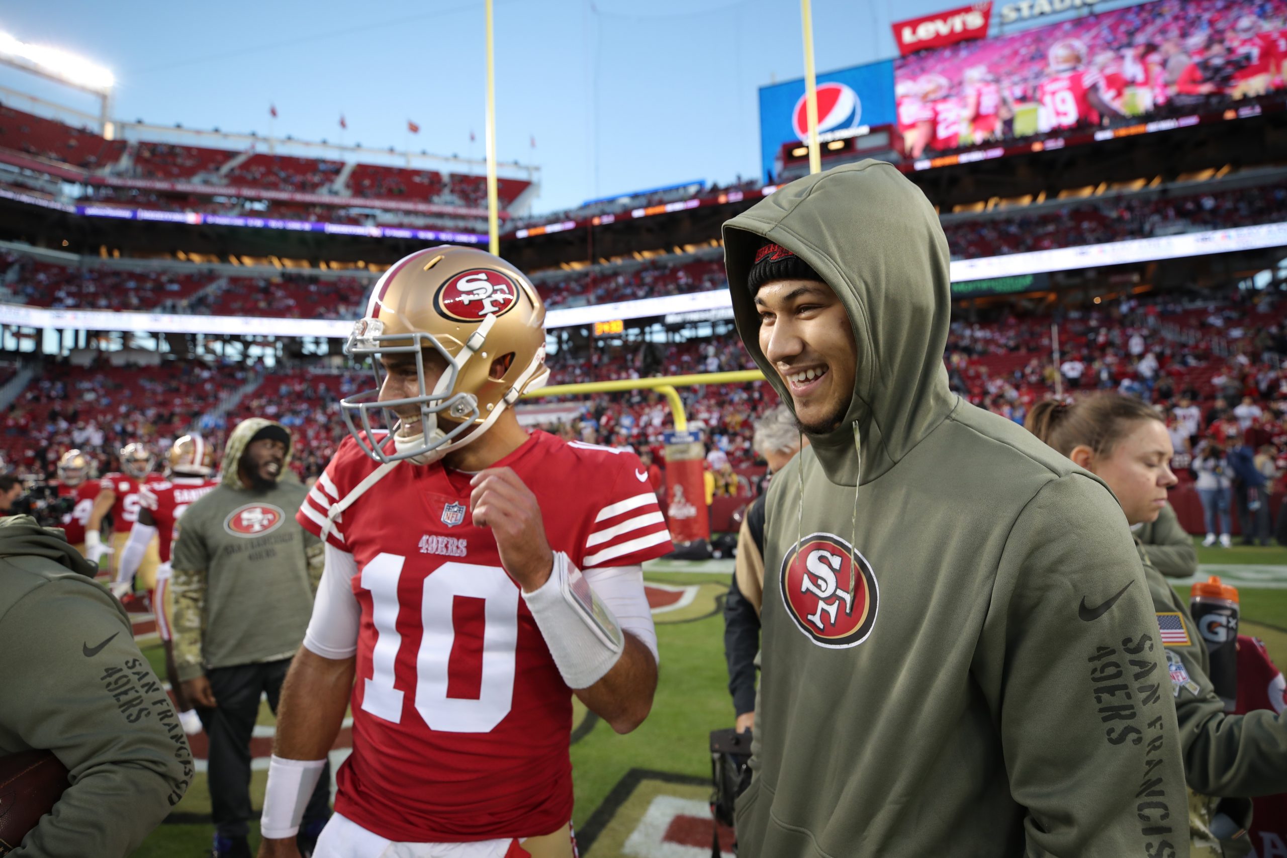 Jimmy Garoppolo #10 and Trey Lance #5 of the San Francisco 49ers on the field before the game again...