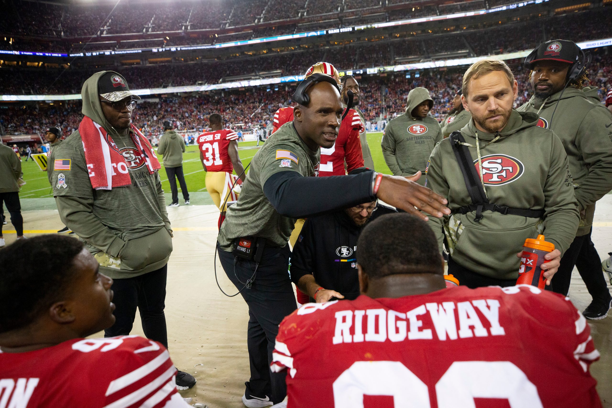 Defensive Coordinator DeMeco Ryans of the San Francisco 49ers congratulates the defense on the side...