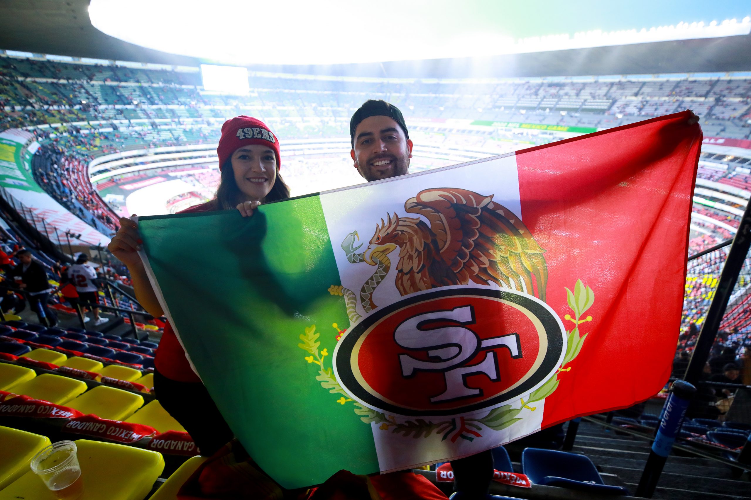 Fans pose for a photo prior to a game between the San Francisco 49ers and Arizona Cardinals at Esta...