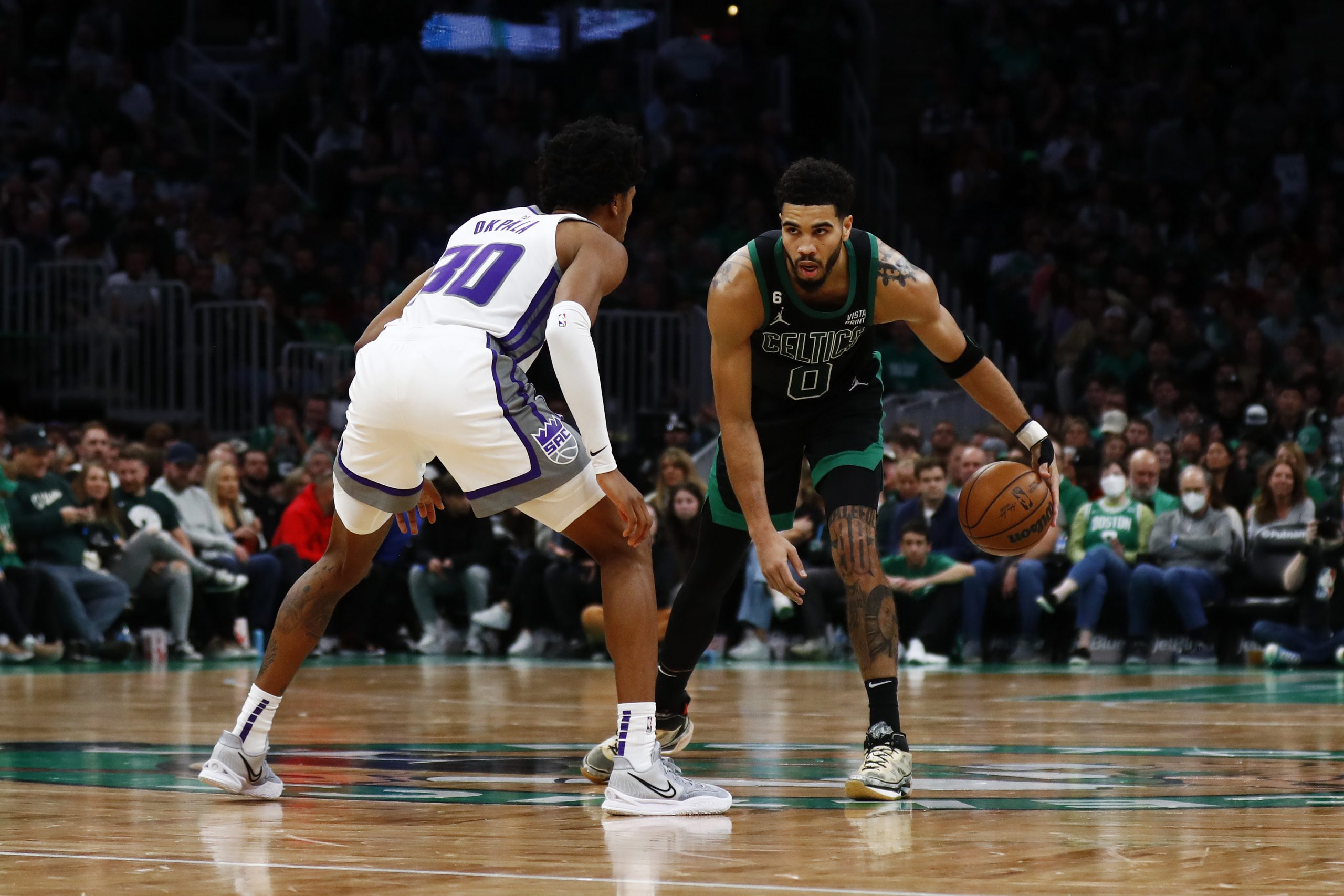 BOSTON, MASSACHUSETTS - NOVEMBER 25: Jayson Tatum #0 of the Boston Celtics brings the ball up court...