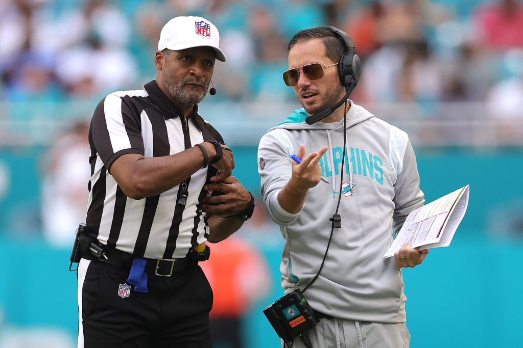 Head coach Mike McDaniel of the Miami Dolphins talks with an official during the first half in the ...
