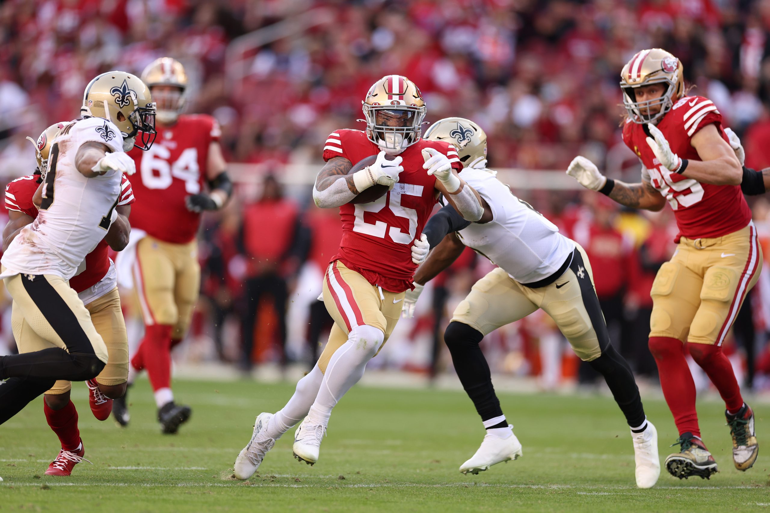 SANTA CLARA, CALIFORNIA - NOVEMBER 27: Elijah Mitchell #25 of the San Francisco 49ers runs the ball...
