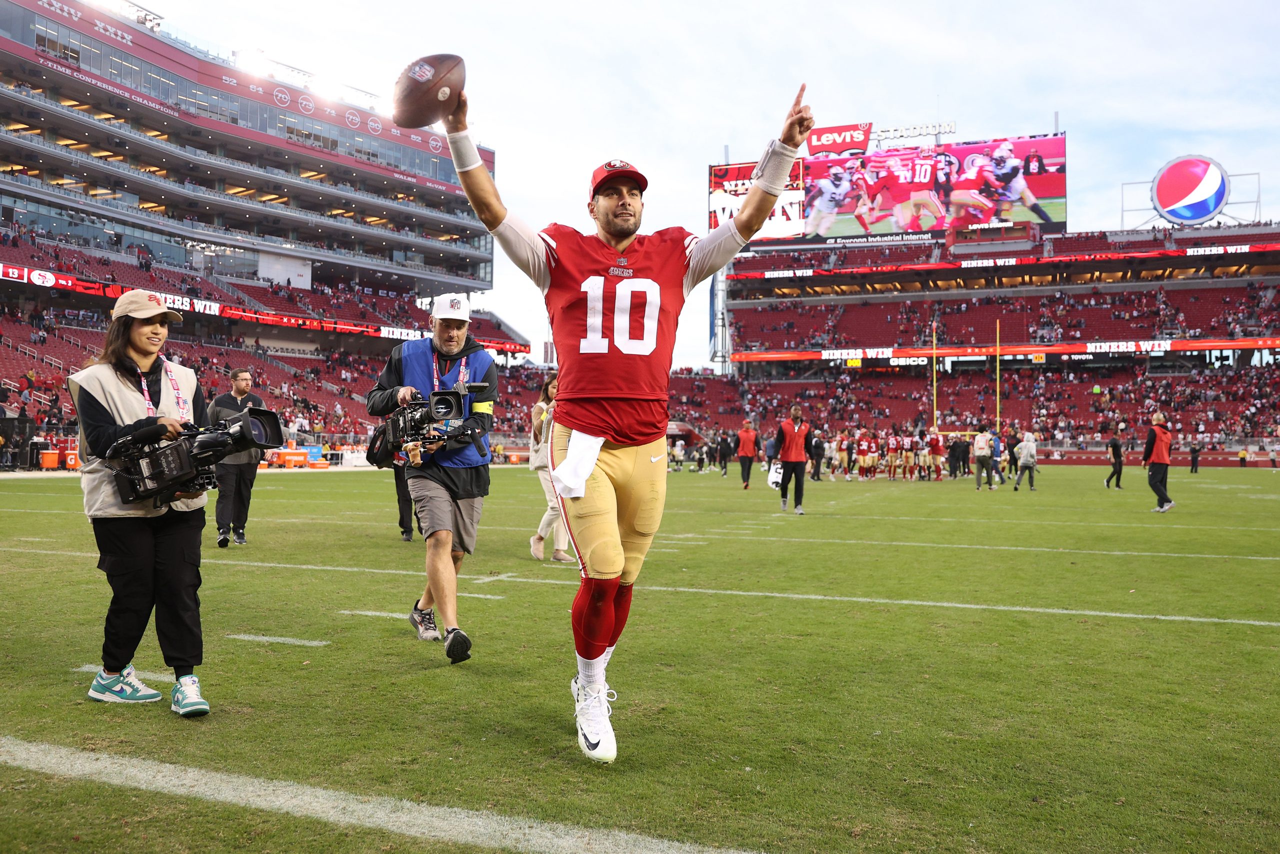 Jimmy Garoppolo #10 of the San Francisco 49ers walks off the field after a win over the New Orleans...