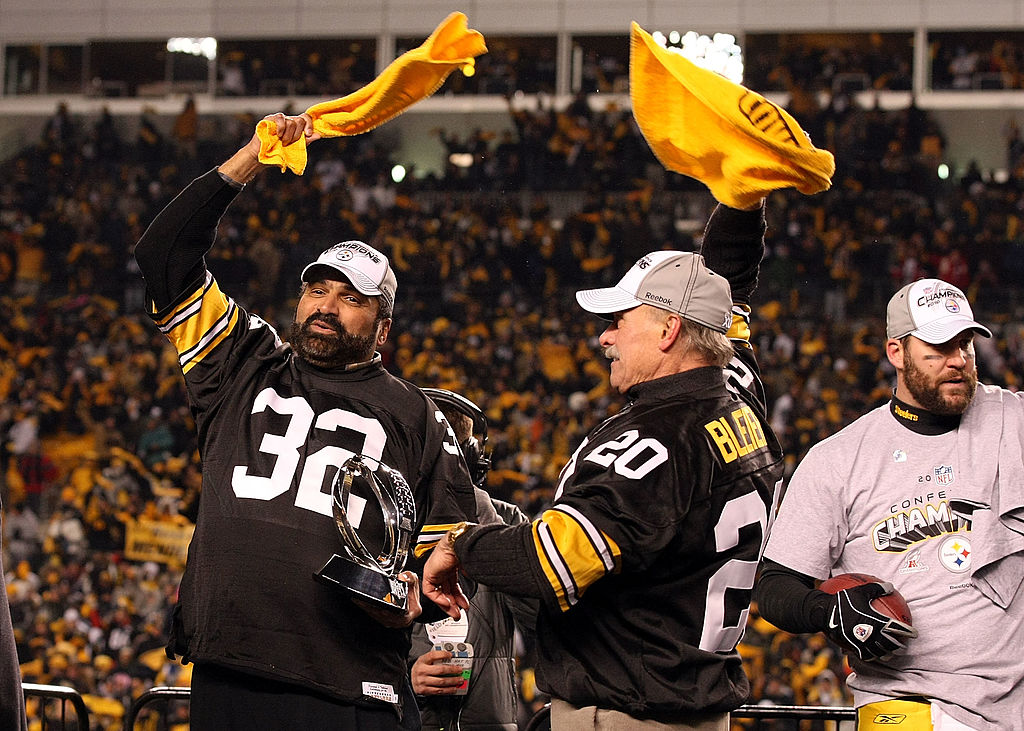 Former Pittsburgh Steelers players Franco Harris #32 and Rocky Blier #20 wave "Terrible Towels" as ...