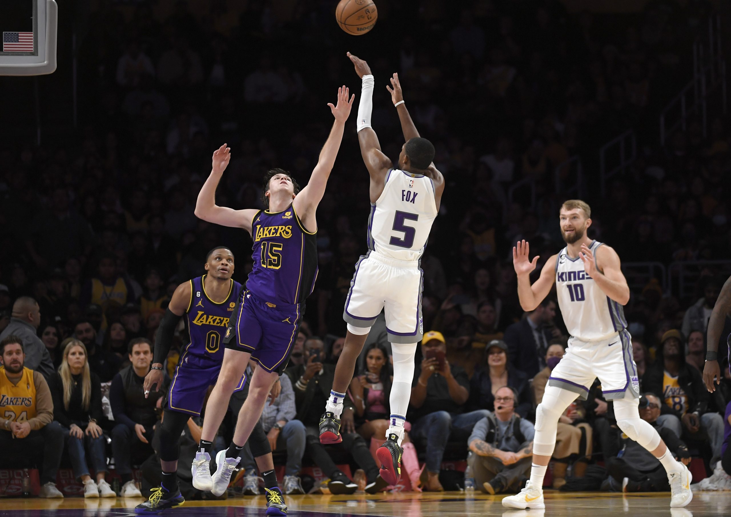 LOS ANGELES, CA - NOVEMBER 11: De'Aaron Fox #5 of the Sacramento Kings scores a three-point basket ...