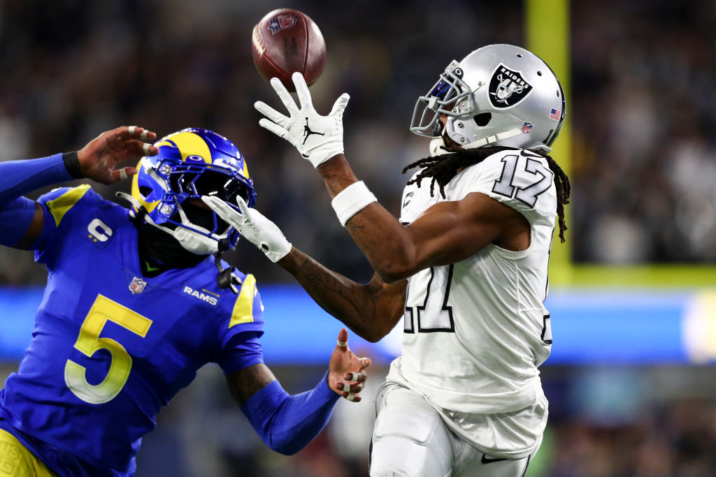 Davante Adams #17 of the Las Vegas Raiders catches a pass over Jalen Ramsey #5 of the Los Angeles R...