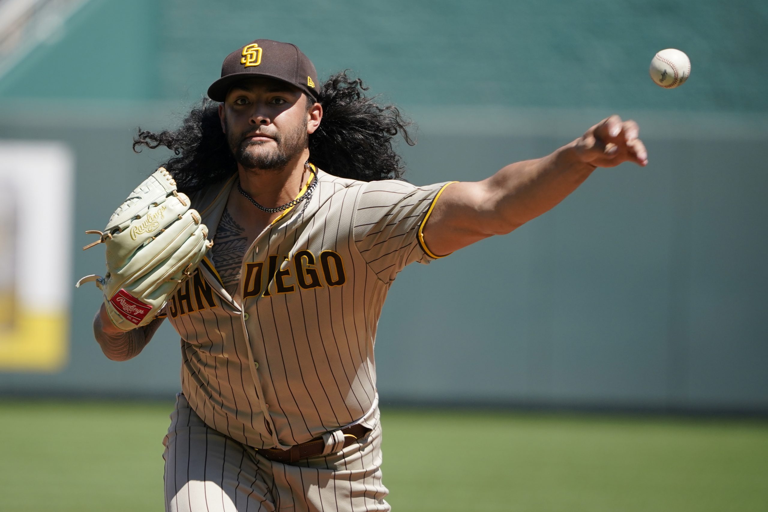 Starting pitcher Sean Manaea #55 of the San Diego Padres warms up prior to throwing against the Kan...