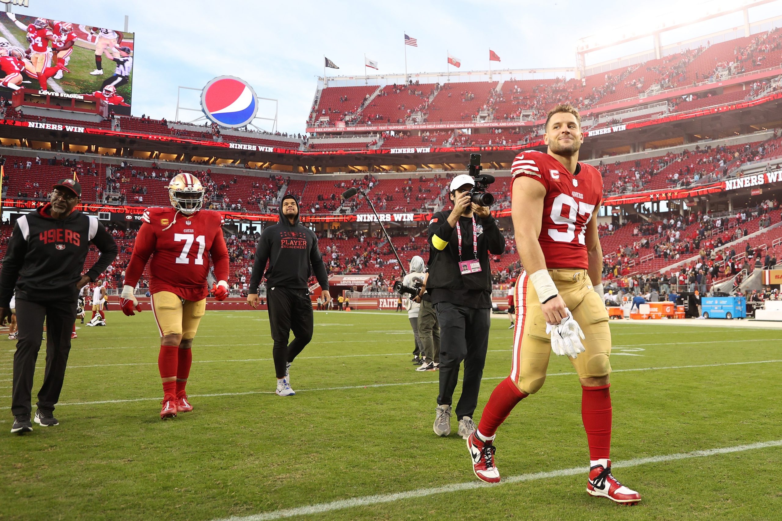 Nick Bosa #97 of the San Francisco 49ers on the field after a win over the New Orleans Saints at Le...