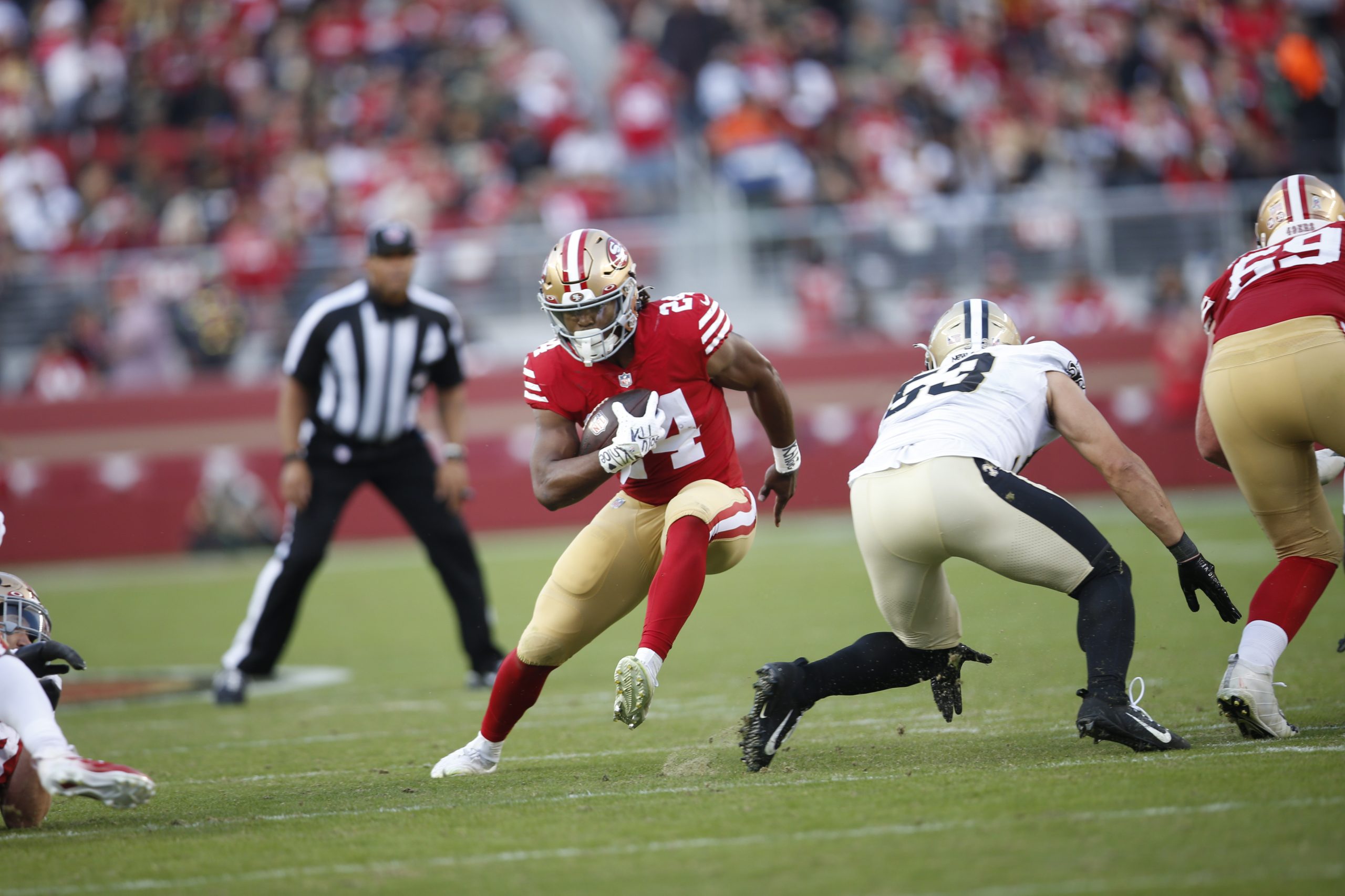 Jordan Mason #24 of the San Francisco 49ers rushes during the game against the New Orleans Saints a...