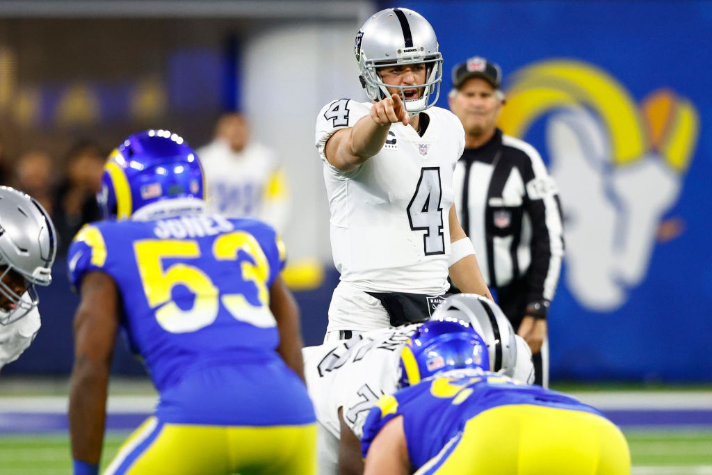 Derek Carr #4 of the Las Vegas Raiders signals a play call against the Los Angeles Rams during the ...