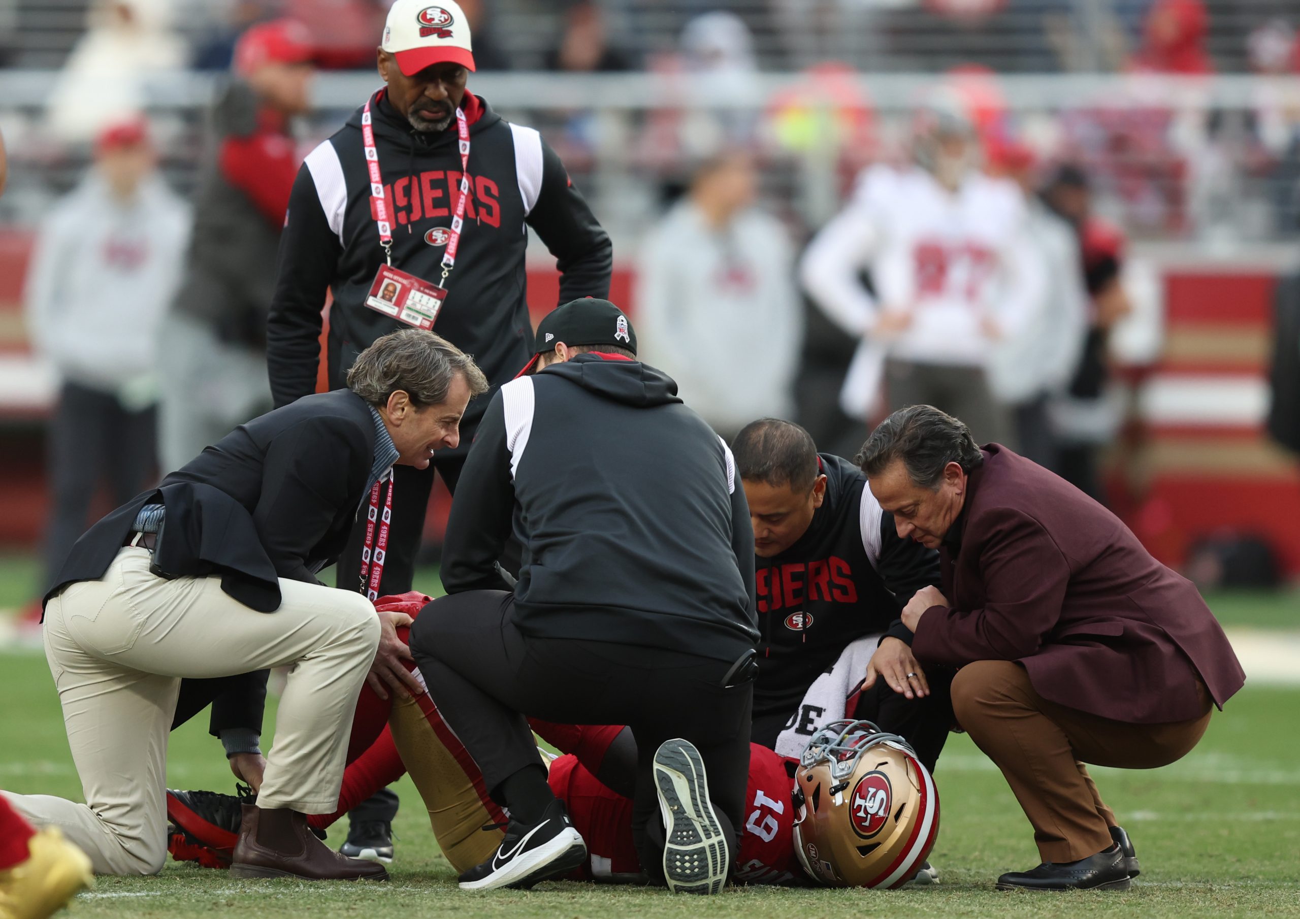 Deebo Samuel #19 of the San Francisco 49ers is looked at by the medical staff after being injured d...
