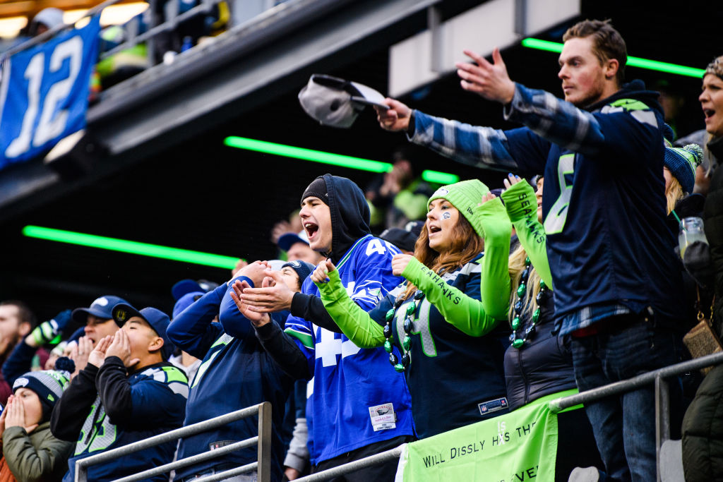 Seattle Seahawks fans cheer on their team against the Carolina Panthers at Lumen Field on December ...
