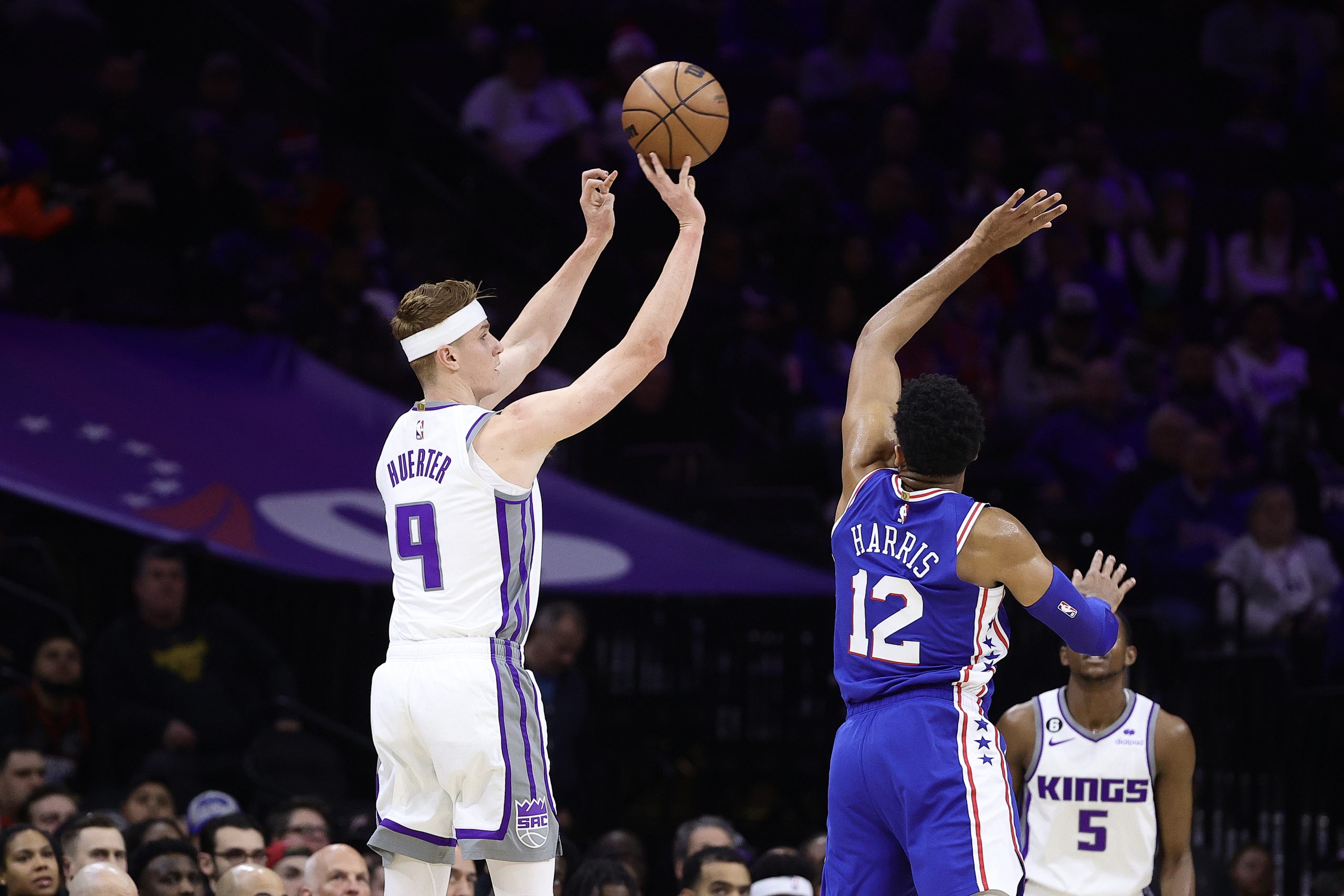 Kevin Huerter #9 of the Sacramento Kings shoots over Tobias Harris #12 of the Philadelphia 76ers du...