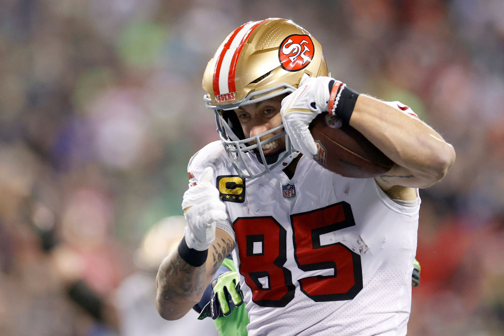 George Kittle #85 of the San Francisco 49ers carries the ball for a touchdown against the Seattle S...
