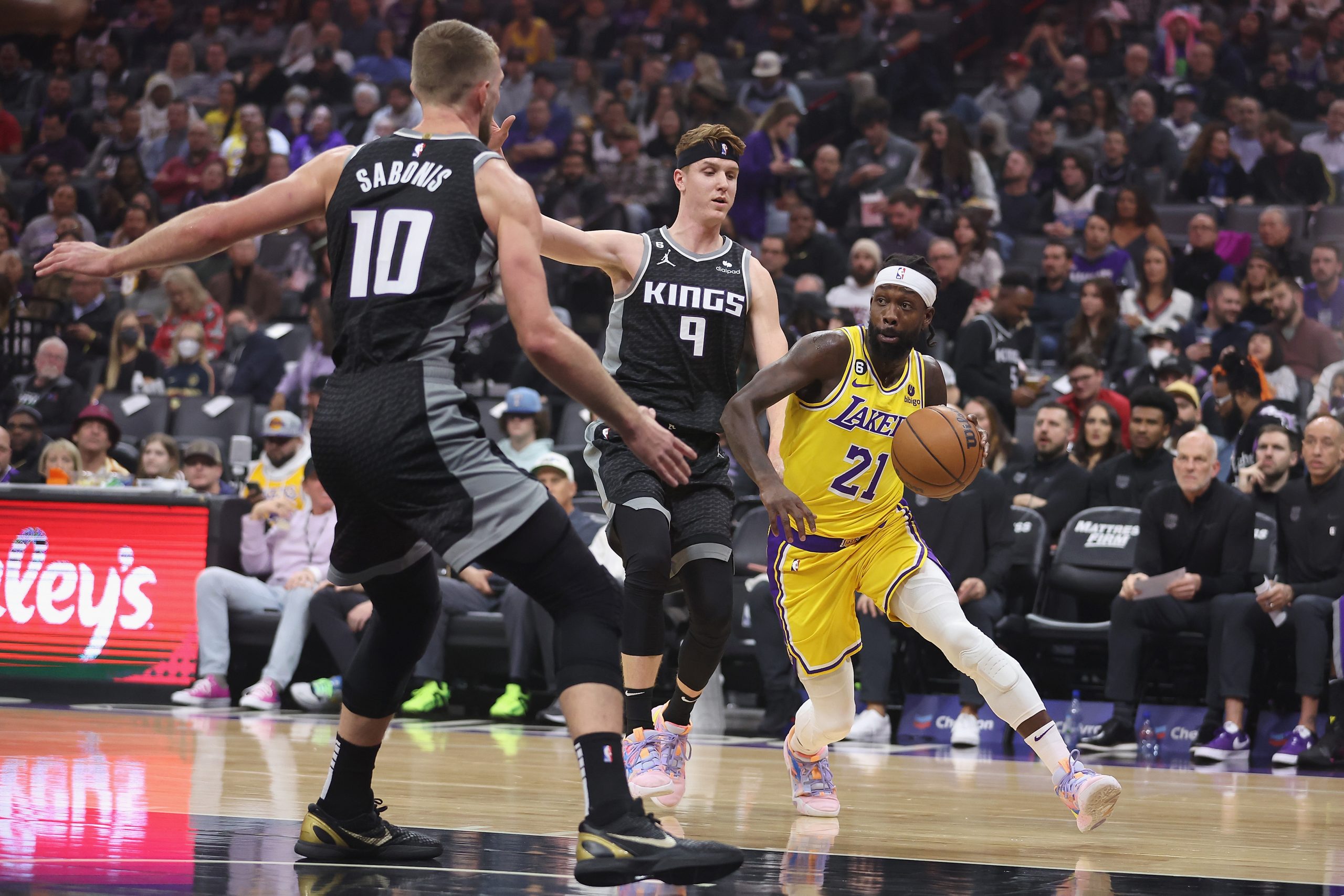 Patrick Beverley #21 of the Los Angeles Lakers drives to the basket against Kevin Huerter and Doman...