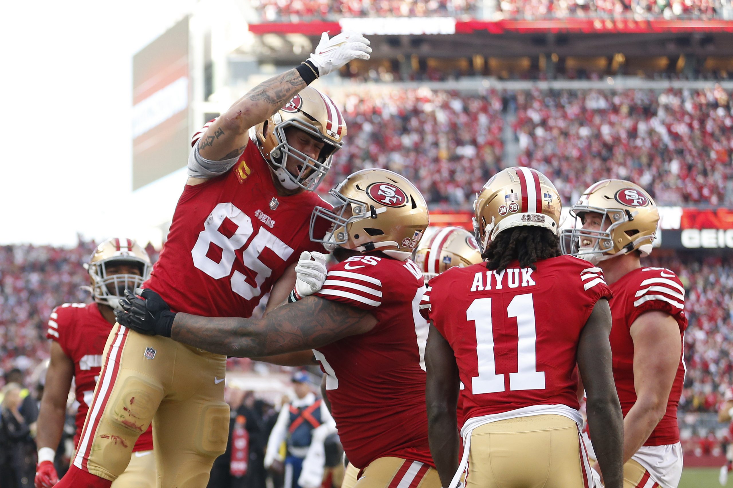 George Kittle #85 of the San Francisco 49ers celebrates a touchdown during the third quarter in the...