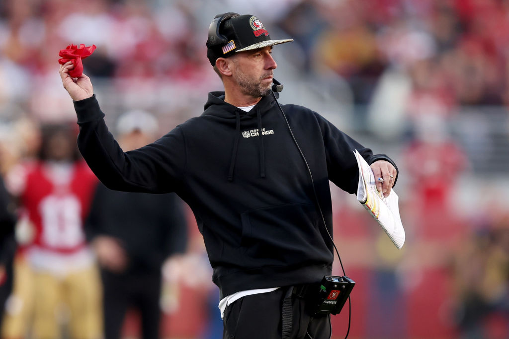 Head coach Kyle Shanahan of the San Francisco 49ers throws the replay flag during the second half i...