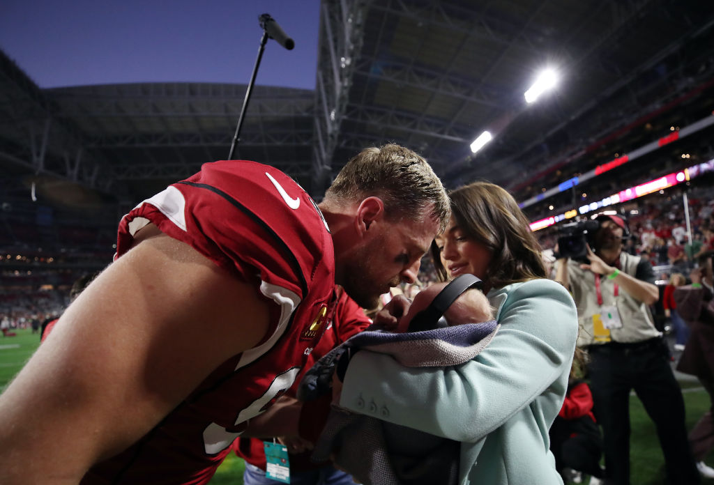 J.J. Watt #99 of the Arizona Cardinals greets his wife and newborn baby prior tot he game against t...