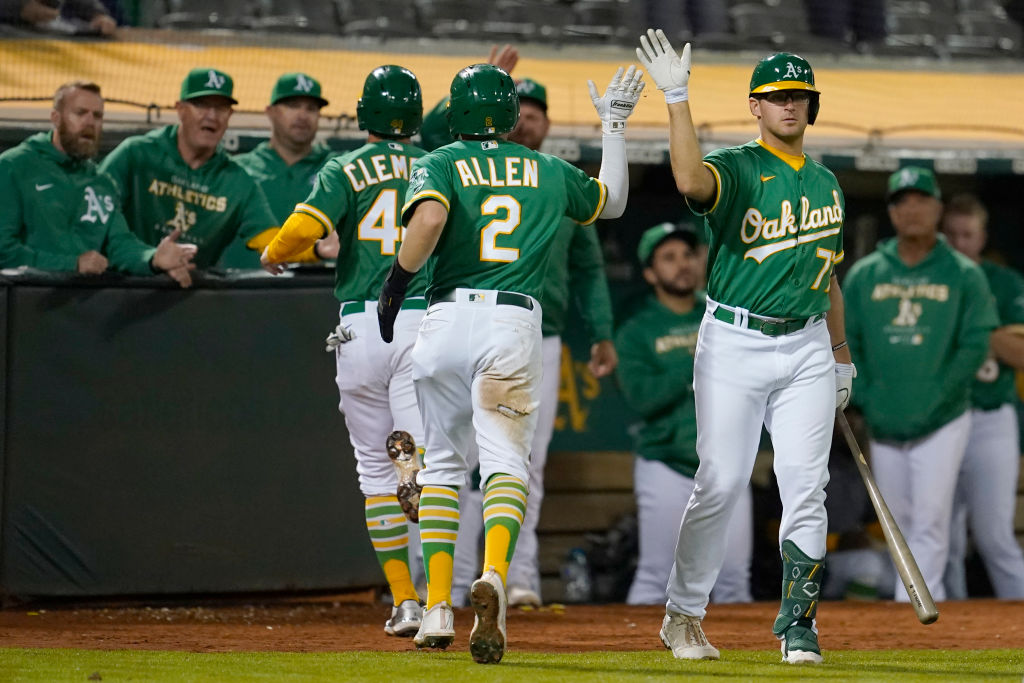 Nick Allen #2 of the Oakland Athletics celebrates after scoring a run in the ninth inning against t...