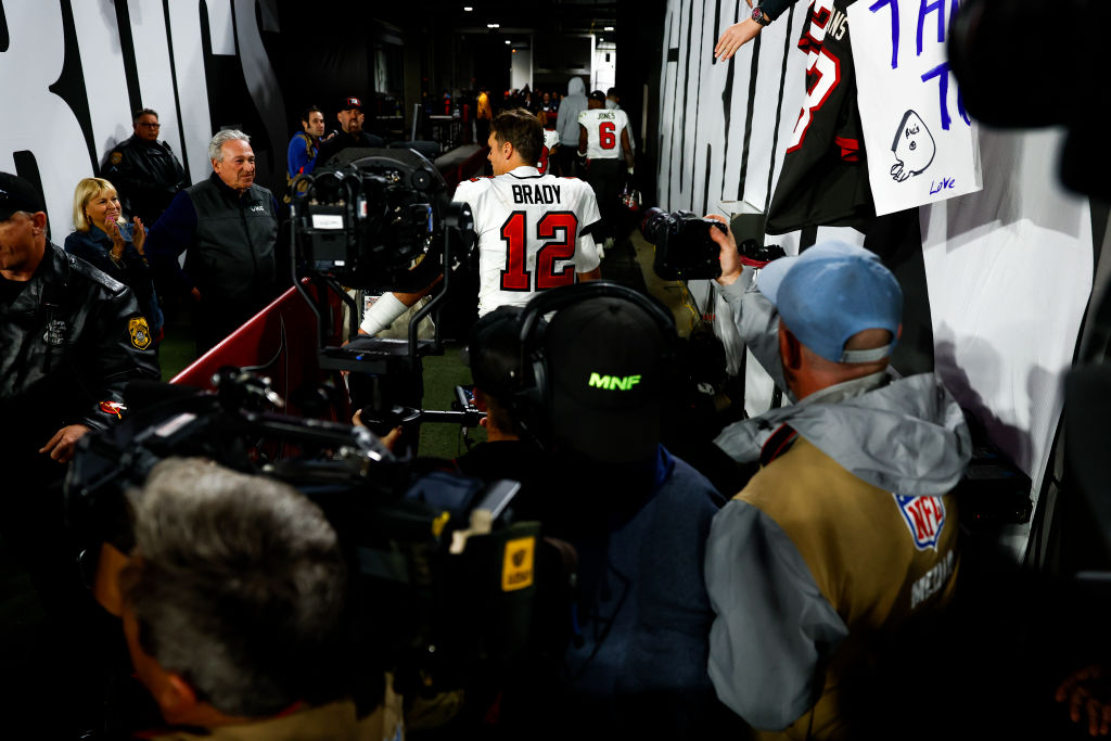 Tom Brady #12 of the Tampa Bay Buccaneers exits the field through the tunnel after an NFL wild card...