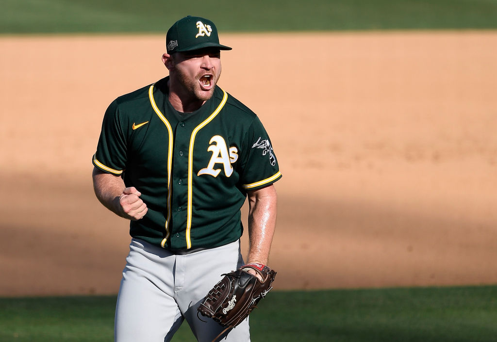 Liam Hendriks #16 of the Oakland Athletics celebrates a 9-7 win against the Houston Astros in Game ...