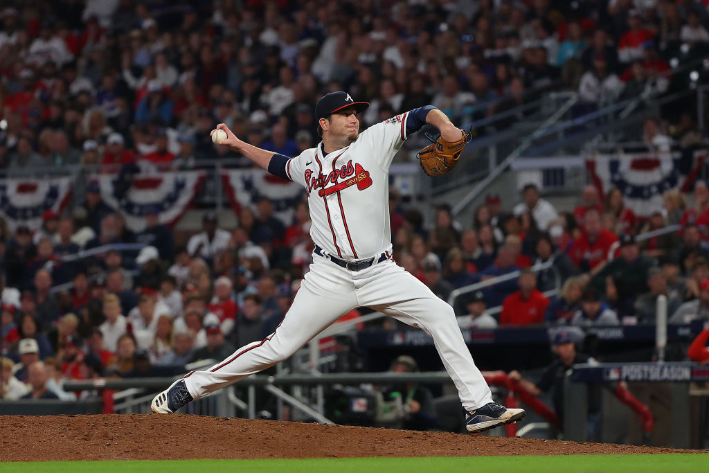 Luke Jackson #77 of the Atlanta Braves throws a pitch during the seventh inning of Game Six of the ...