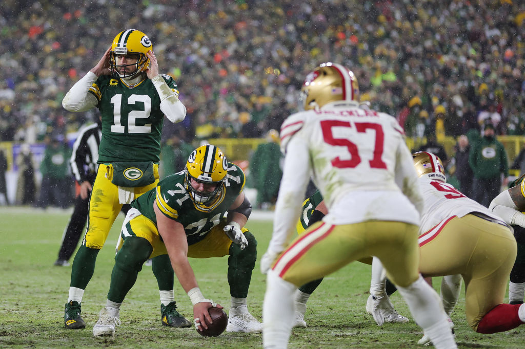 Aaron Rodgers #12 of the Green Bay Packers prepares for the snap during the game against the San Fr...
