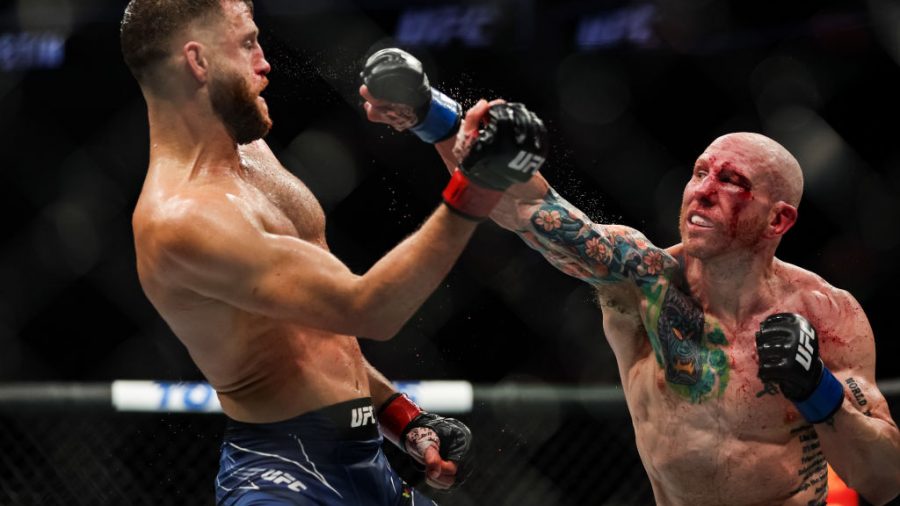 Calvin Kattar and Josh Emmett exchange strikes during their featherweight fight at the UFC Fight Night event at Moody Center on June 18, 2022 in Austin, Texas.