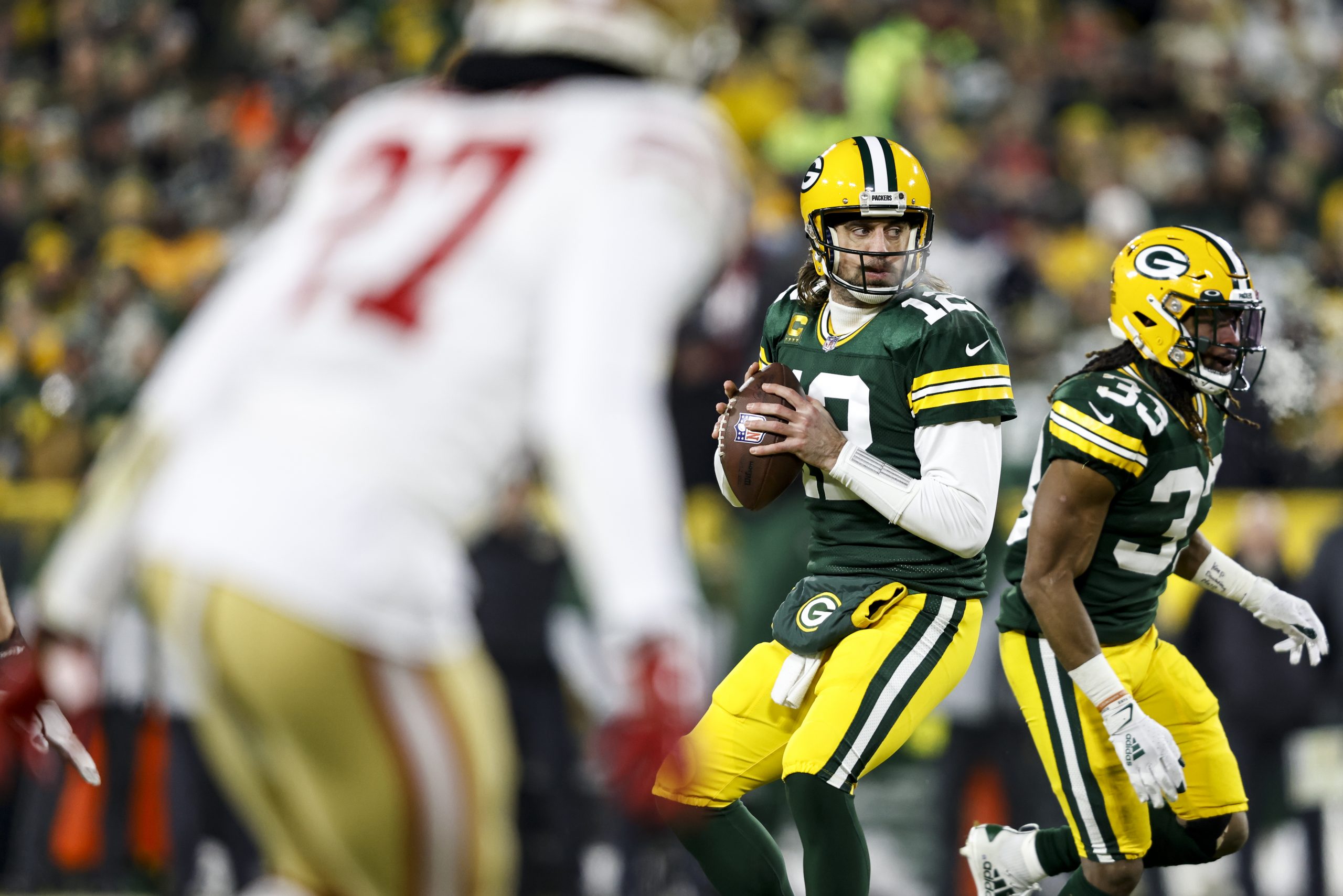GREEN BAY, WISCONSIN - JANUARY 22: Aaron Rodgers #12 of the Green Bay Packers looks to pass during ...