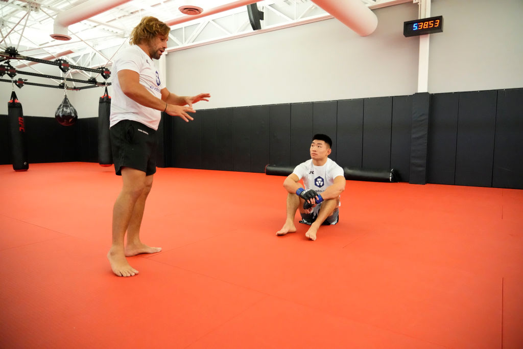 Song Yadong of China warms up backstage with his coach Urijah Faber during the UFC Fight Night even...