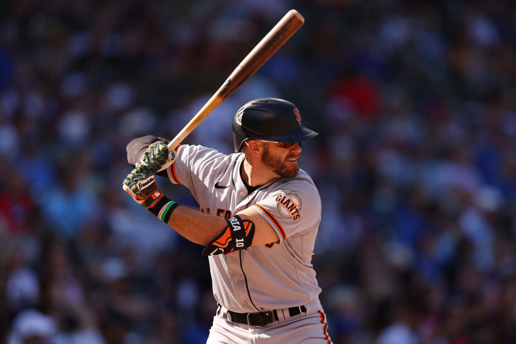 Evan Longoria #10 of the San Francisco Giants at bat against the Chicago Cubs at Wrigley Field on S...