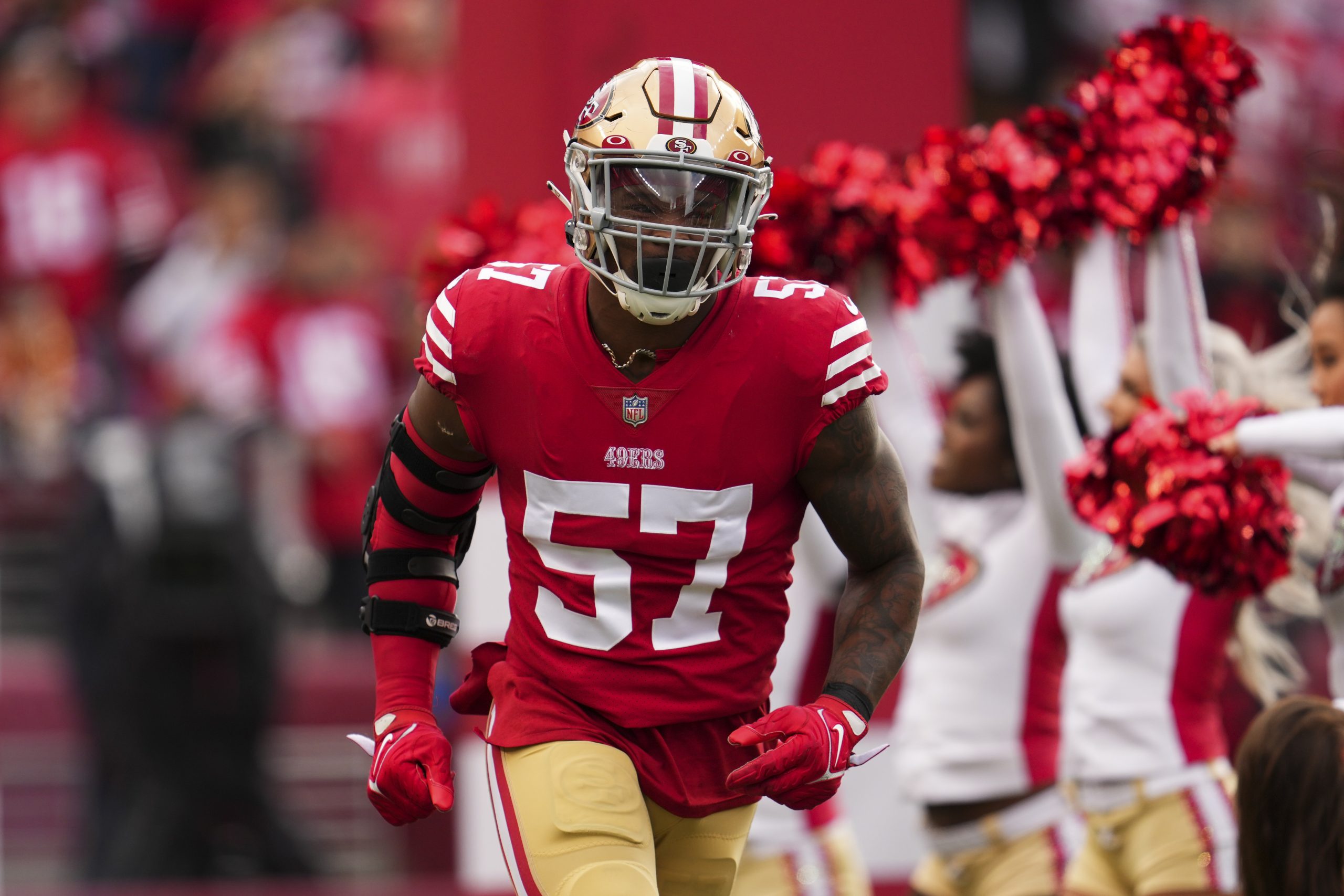Dre Greenlaw #57 of the San Francisco 49ers runs out during introductions against the Tampa Bay Buc...