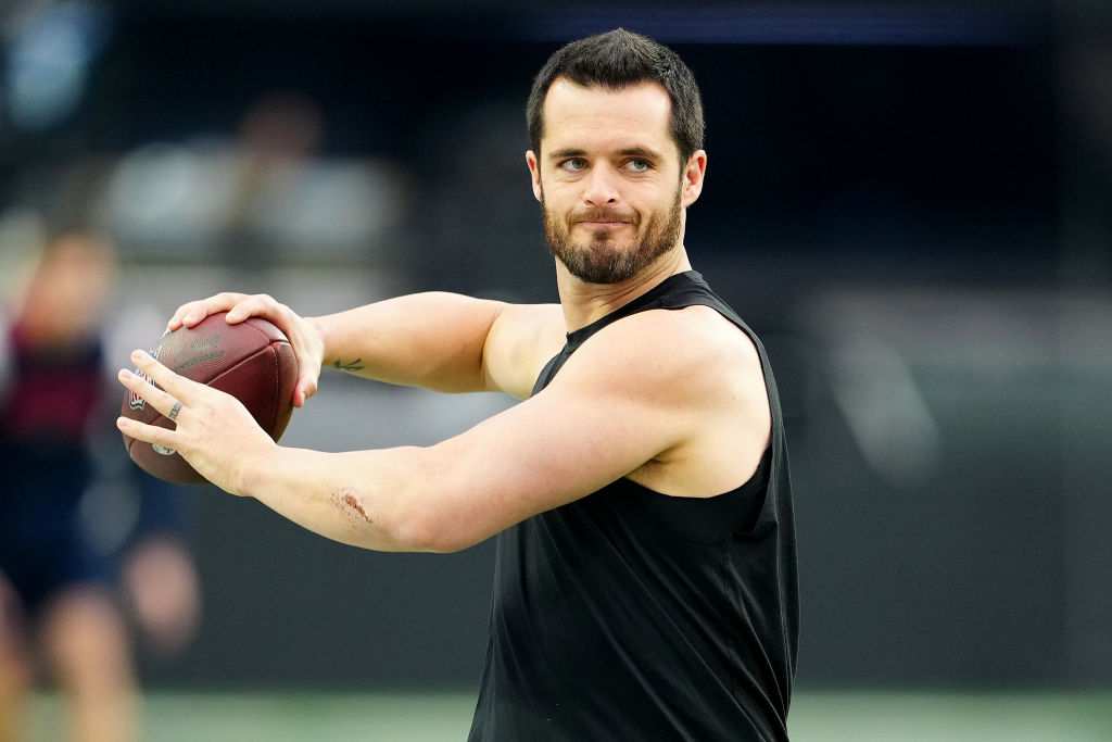 Derek Carr #4 of the Las Vegas Raiders warms up prior to a game against the New England Patriots at...