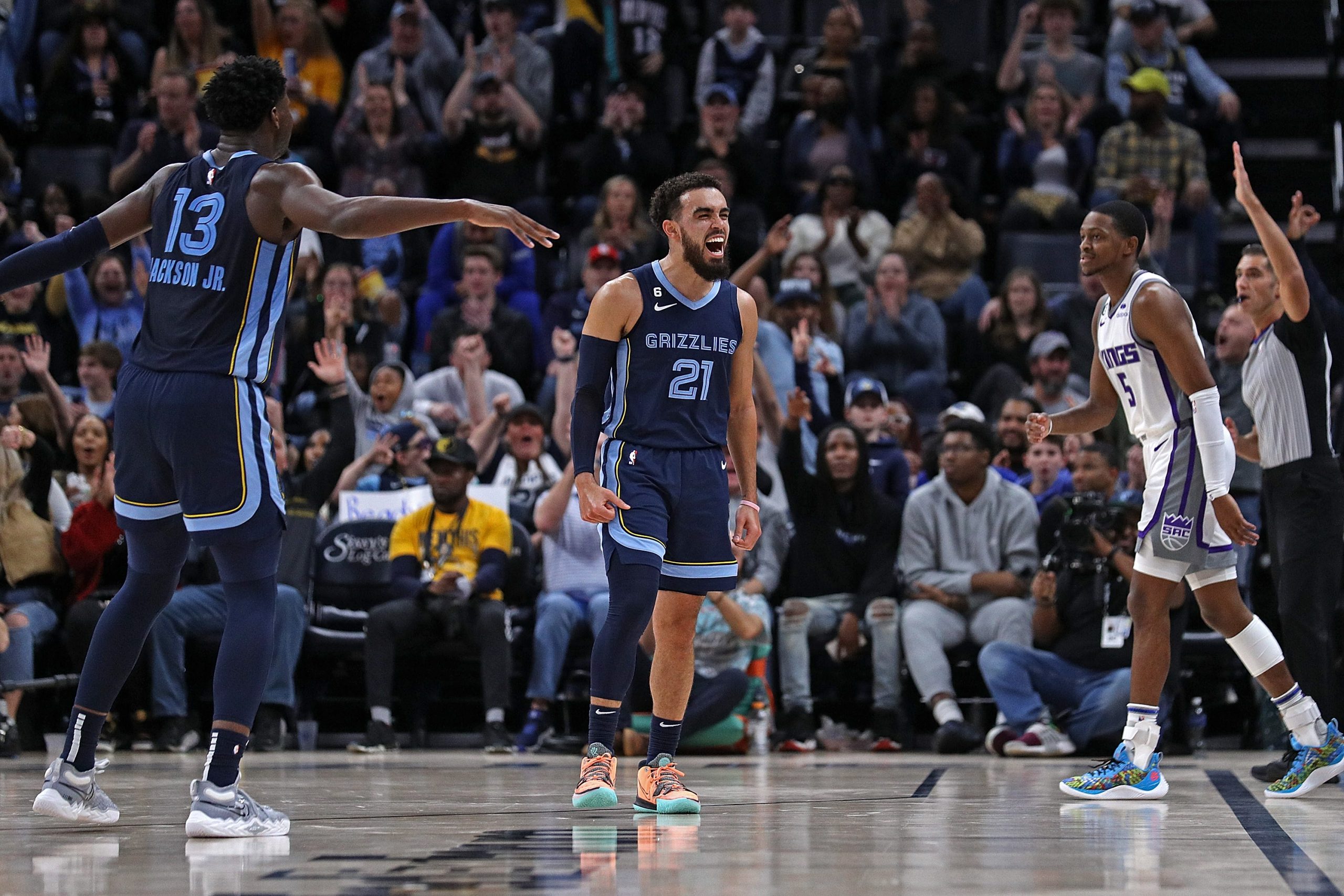 MEMPHIS, TENNESSEE - JANUARY 01: Tyus Jones #21 of the Memphis Grizzlies reacts during the first ha...