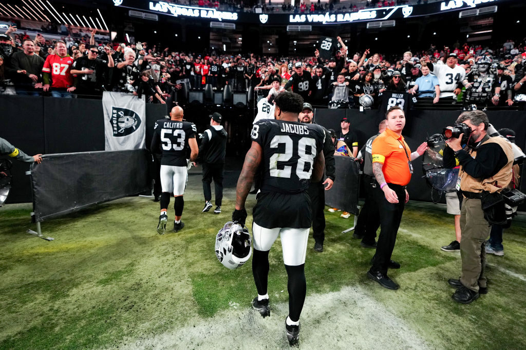 Josh Jacobs #28 of the Las Vegas Raiders walks off the field after losing to the Kansas City Chiefs...