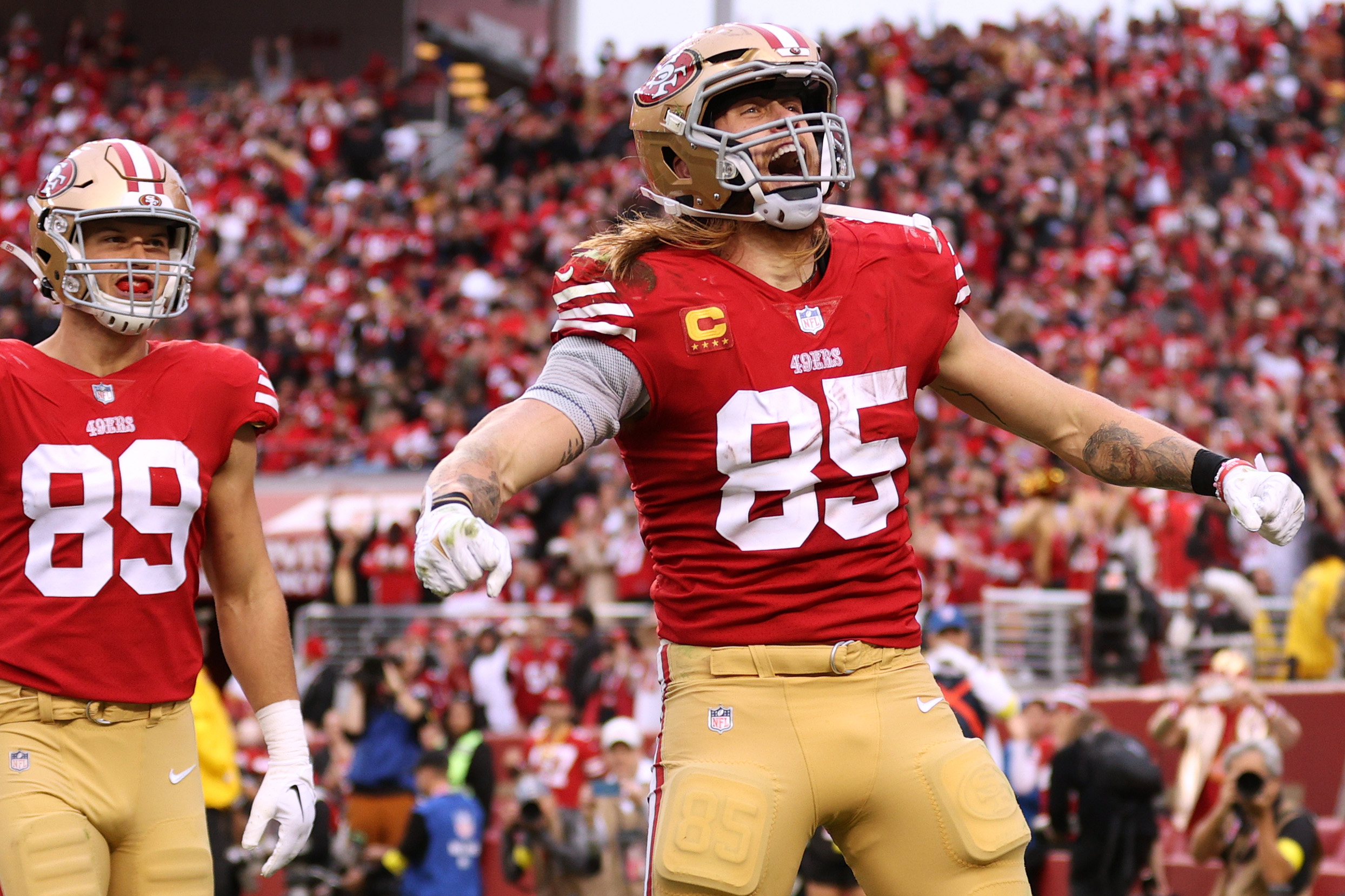 George Kittle #85 of the San Francisco 49ers celebrates after scoring a touchdown during the third ...