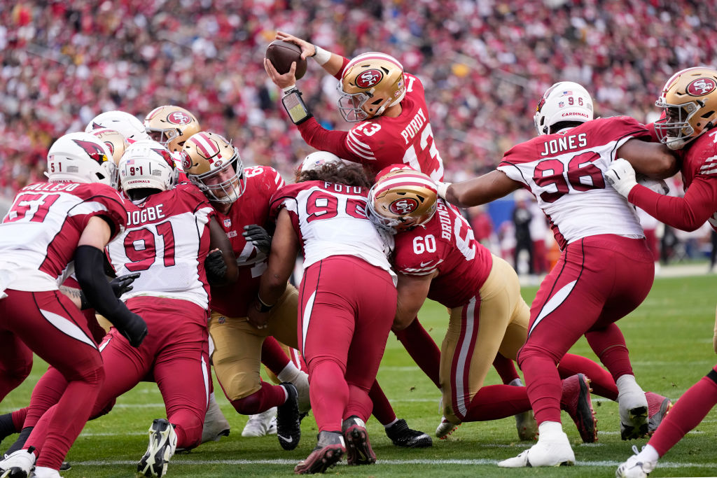 Brock Purdy #13 of the San Francisco 49ers looks to pass the ball during the fourth quarter of the ...
