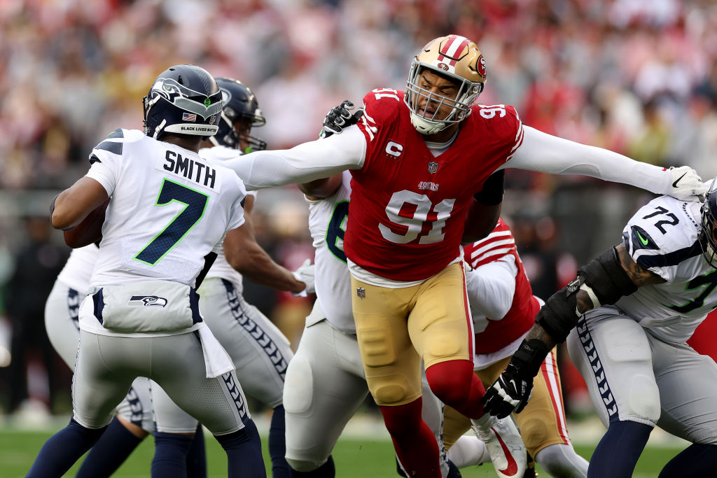 Arik Armstead #91 of the San Francisco 49ers sacks Geno Smith #7 of the Seattle Seahawks during the...