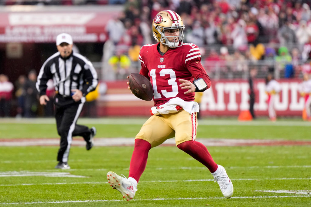 Brock Purdy #13 of the San Francisco 49ers looks to pass against the Seattle Seahawks during the se...