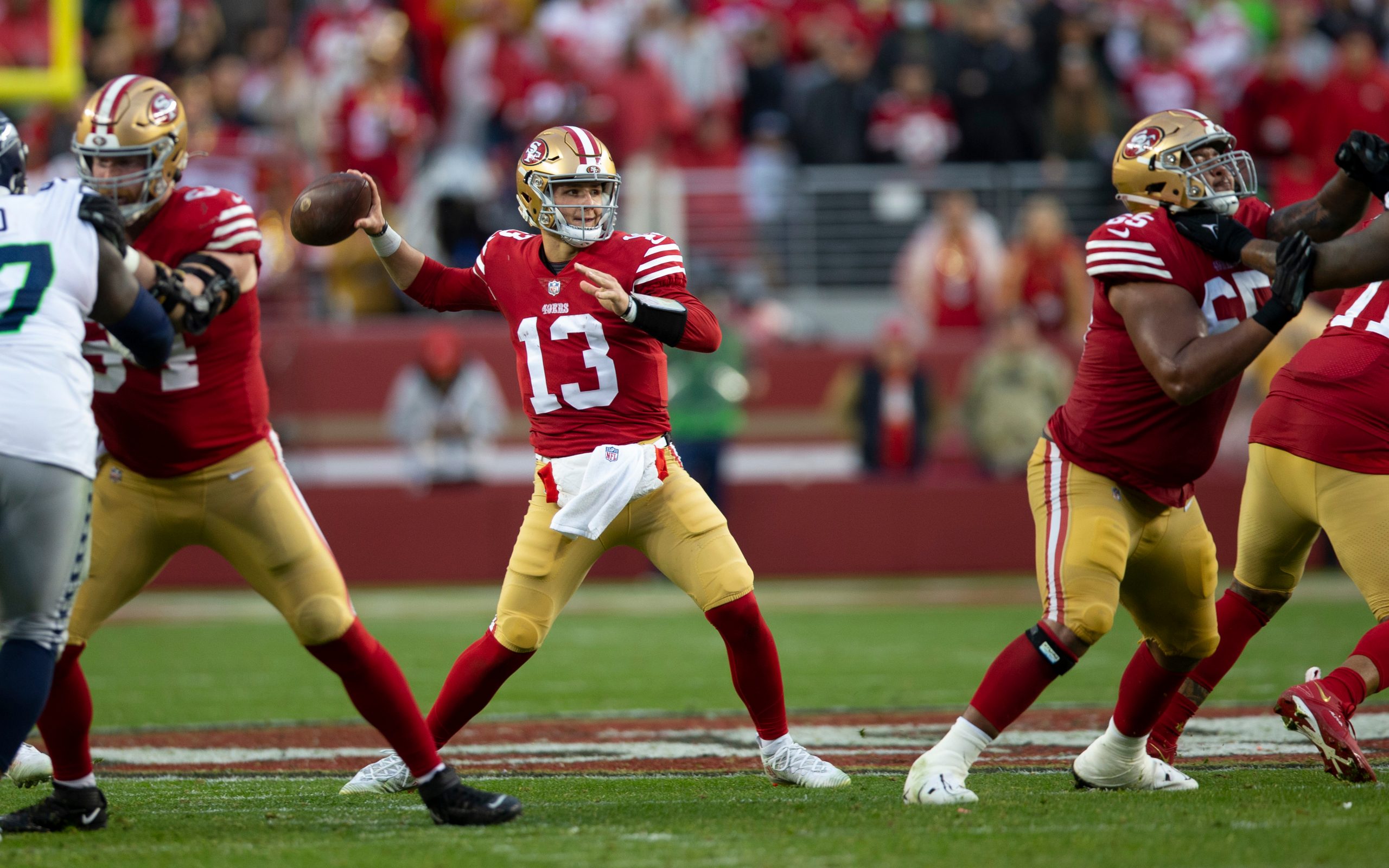 Brock Purdy #13 of the San Francisco 49ers passes against the Seattle Seahawks during the NFC Wild ...